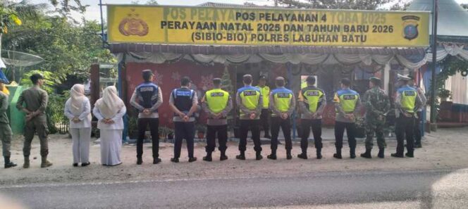 
					Pengamanan Natal dan Tahun Baru (Nataru) di Pos Pengamanan Simpang Sibio-bio, Kelurahan Bandar Durian, Kecamatan Aek Natas, Senin (22/12/2025)
