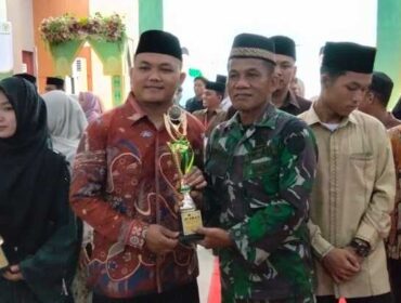 Kapten Inf Arifin Sinaga mewakili Danramil Mayor Inf Parlindungan Sinaga, S.H menghadiri penutupan MTQ ke-XVII dan Festival Seni Qasidah ke-XVIII Tahun 2026 yang berlangsung khidmat di Aula Ahmad Dwi Syukur Kantor Bupati Labura