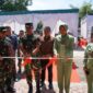 Korem 022/Pantai Timur, Kolonel Inf Sandi Kamidianto, S.I.P., M.I.P., melakukan gunting pita dalam peresmian kegiatan Karya Bakti di Panti Asuhan ATRH Thohiriyah, Desa Nenas Siam, Kecamatan Medang Deras, Kabupaten Batu Bara, Jumat (30/05/2026)