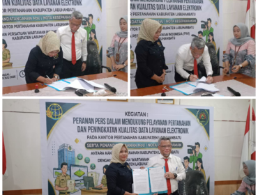 Ketua PWI Labuhanbatu, Erni Manja Hasibuan dan Kepala Kantor BPN Labuhanbatu, Khalid Afdillah Handoyo saat menandatangani Nota Kesepahaman, di Aula Kantor Pertanahan, Jalan Abdul Hakim Nomor 3, Kelurahan Padang Matinggi, Kecamatan Rantau Utara, Kamis (09/07/2026)